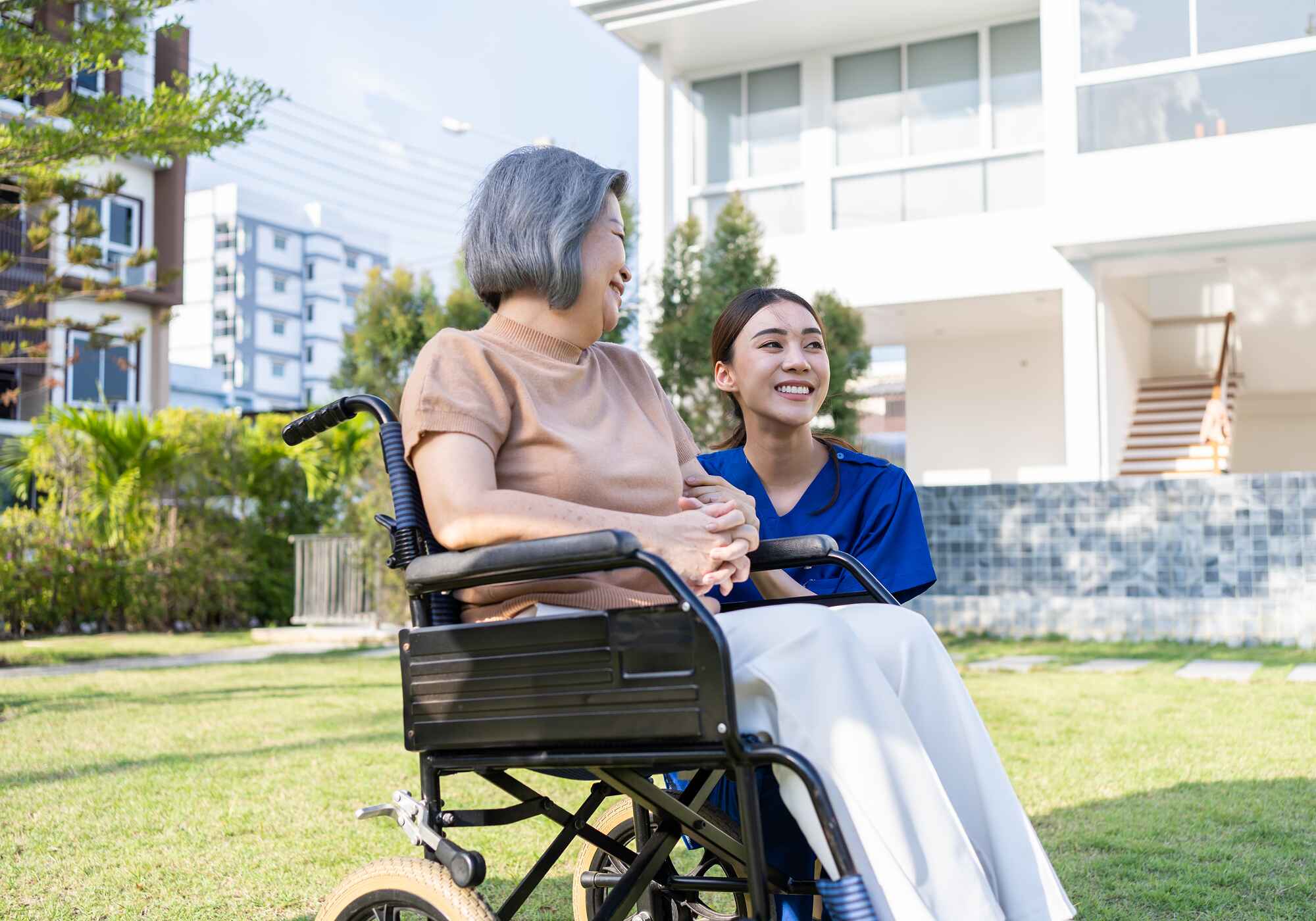 asian-caregiver-nurse-support-disabled-woman-on-wh-83WBUYH.jpg